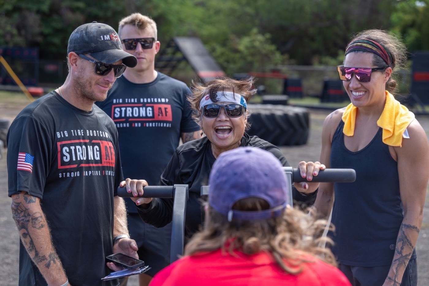 Veterans laughing through a workout at the Koa Challenge on Warrior Field