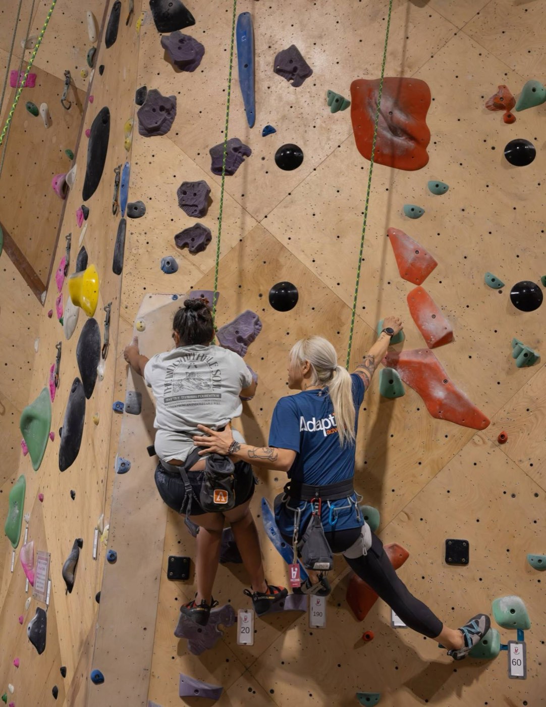 Adaptive climbing with a guide at the Koa Challenge Veteran Games