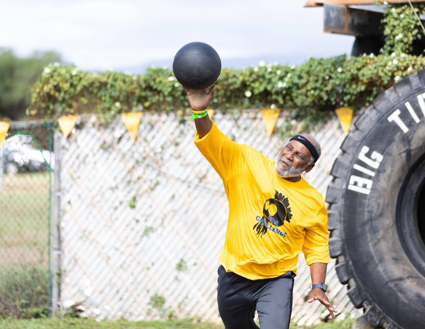 Veteran throwing the ball at the Koa Challenge adaptive fitness event on Warrior Field